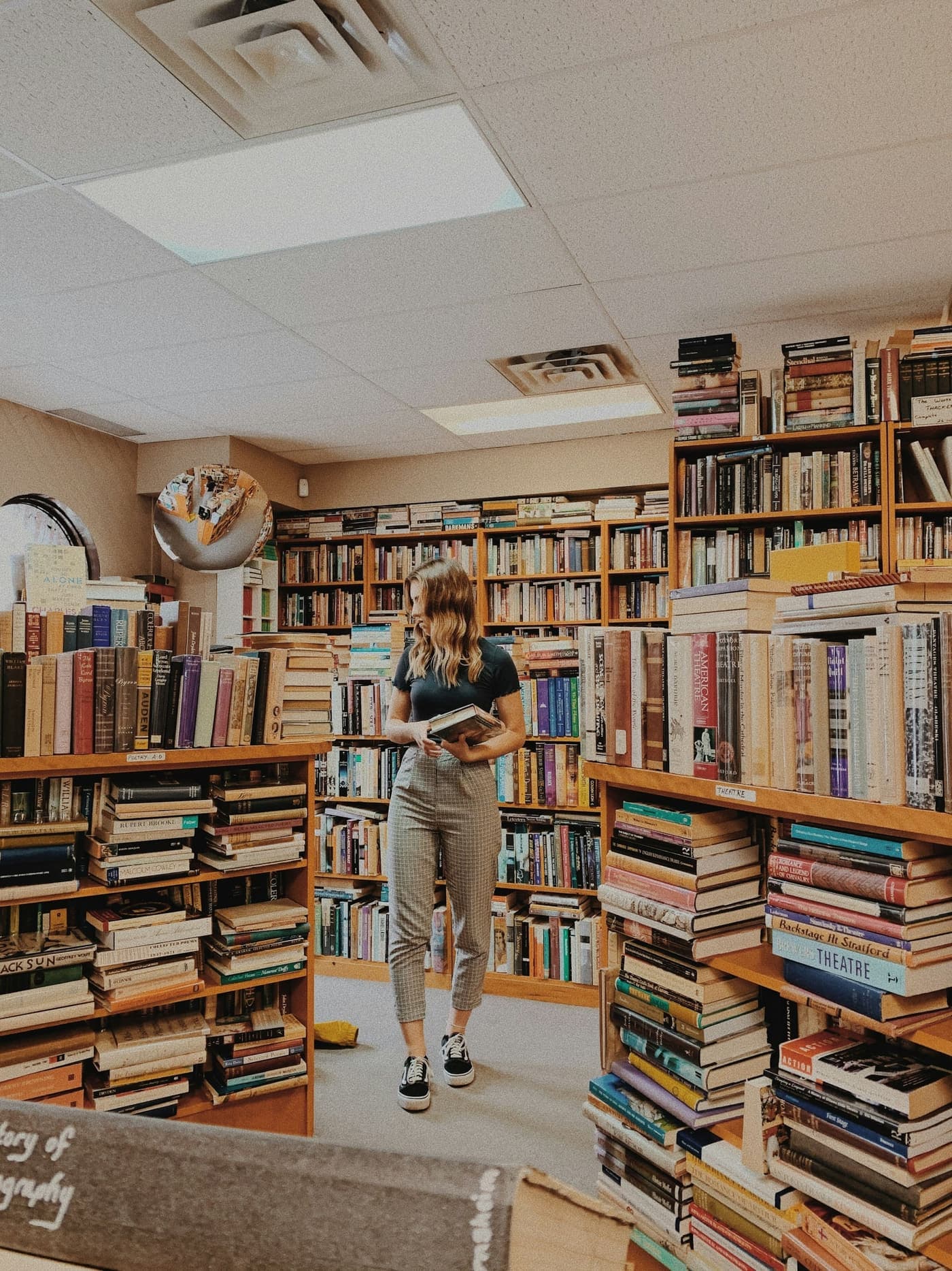 A customer browses the shelves of an independent bookshop
